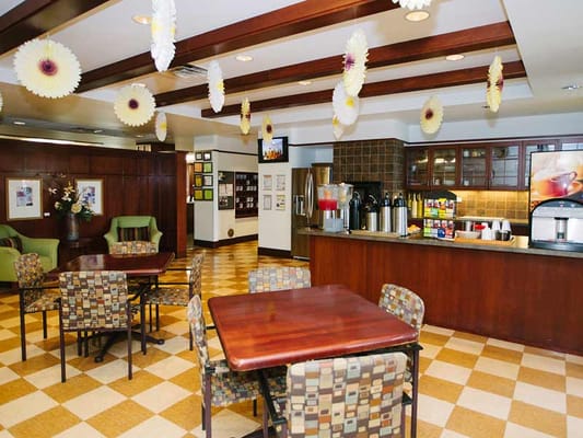 Bright dining area with tables and seating