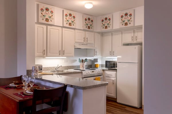 A well-decorated kitchen area in a resident unit