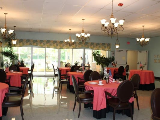 Bright dining room with tables set for a meal