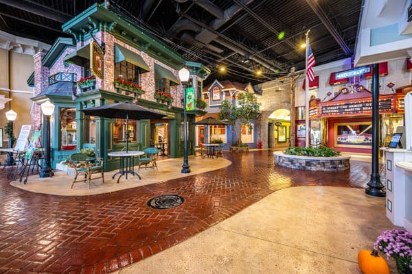 Colorful interior courtyard with themed buildings and seating areas