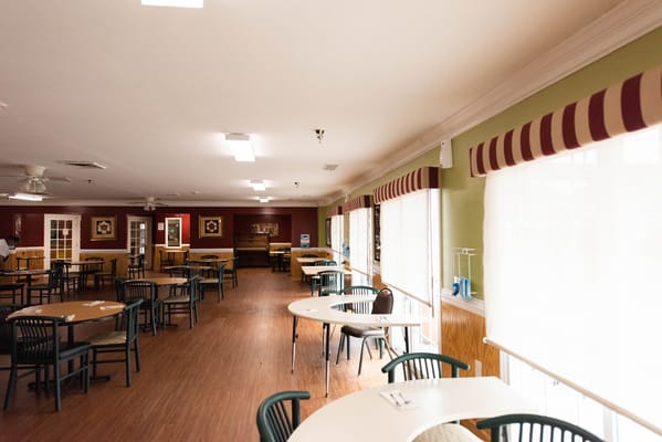 Bright dining room area with tables and chairs