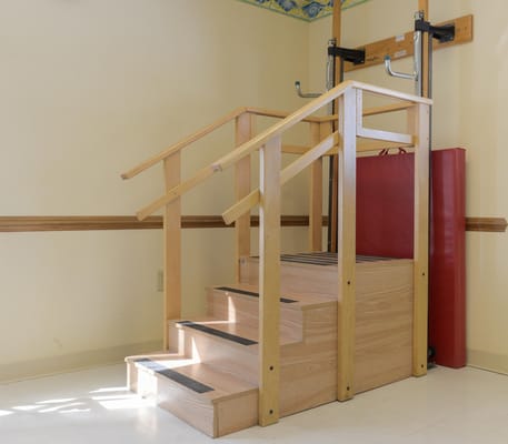 Therapy stairs with handrails in an interior space