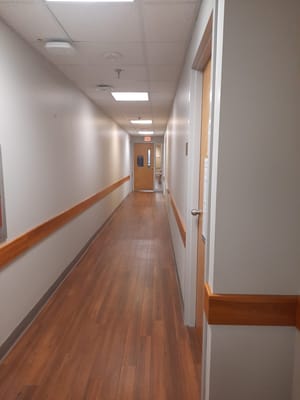 A well-lit hallway in the assisted living facility