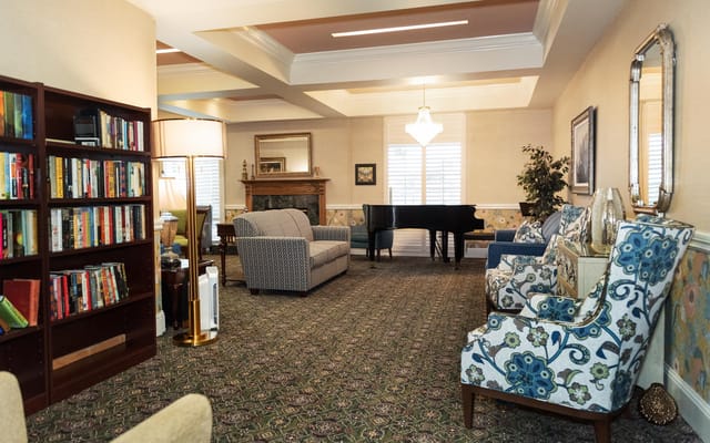 Cozy interior common area with seating and piano