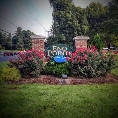 Sign for Eno Pointe Assisted Living with flowers