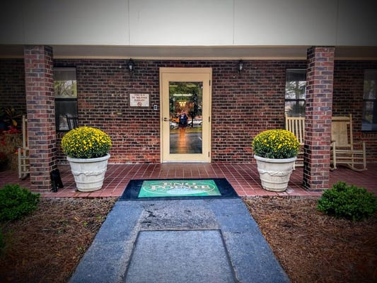 Entrance of Eno Pointe Assisted Living with flower pots