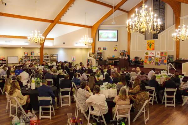 Residents and staff gathered for a community event in the common area