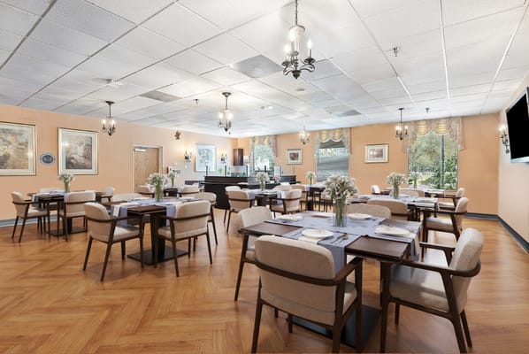 Dining room with tables set for residents