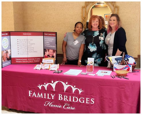 Staff members at a care facility front desk