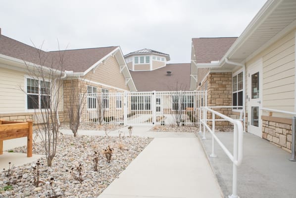 Entrance pathway at Gateway Springs Health Campus with landscaped rocks.