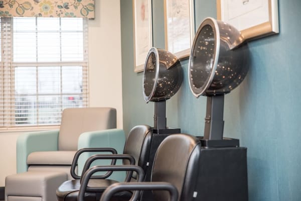 Hair dryers in a senior living facility salon