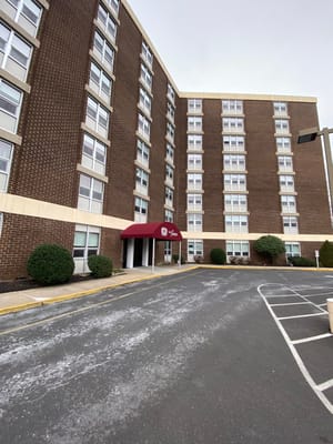 Exterior view of the Gloria Dei Towers building entrance