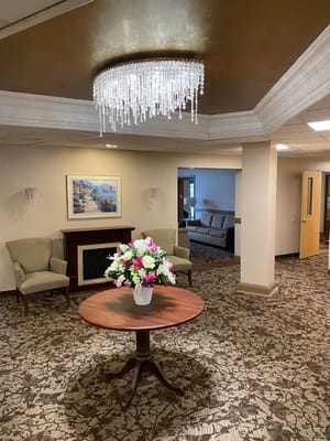 Interior view of a welcoming lobby area with floral centerpiece