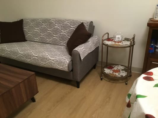 Comfortable interior living area with a couch and side table