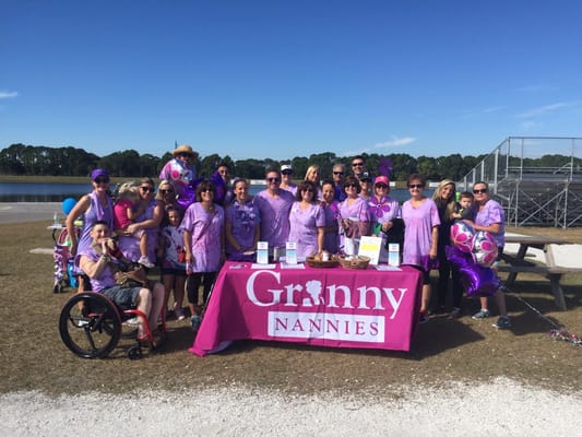 Group of staff and residents celebrating outdoors
