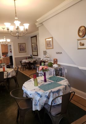 Bright dining area with tables and decor.