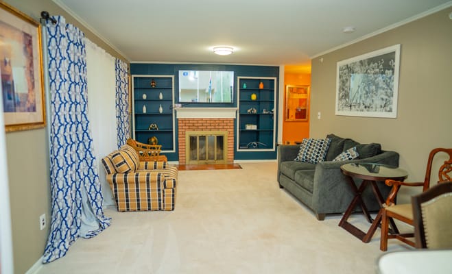 Common area with seating and fireplace