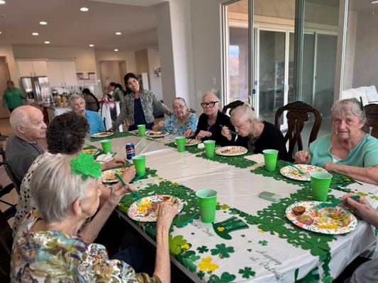Residents enjoying a festive meal in the dining room