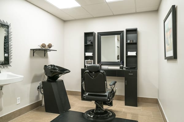 Interior view of a beauty salon with styling chair