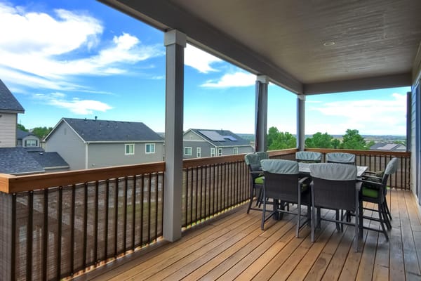 Outdoor patio area with seating and a view