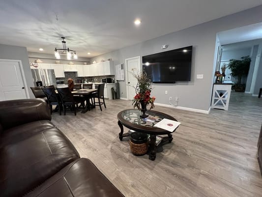 Interior view of a common area with seating and dining space.