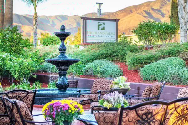 Outdoor space with a fountain and seating area