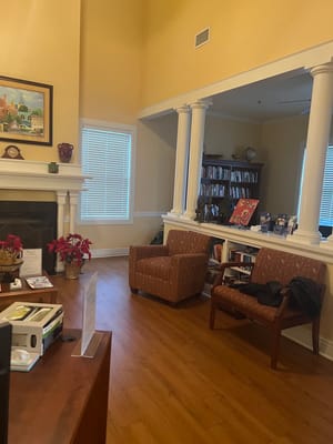 Bright common area with seating and bookshelves
