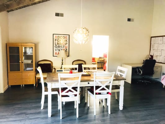 Bright dining area with a large table and chairs
