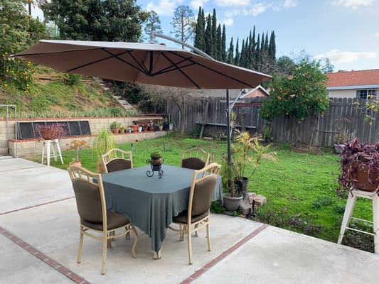 Outdoor dining area with a table and chairs