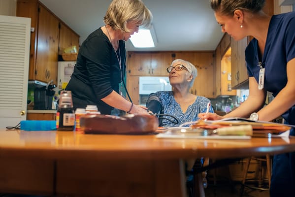 Staff providing care to a resident in a home-like setting