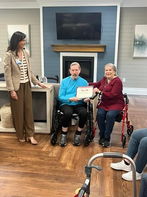 Residents participating in an activity while receiving awards