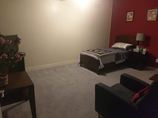 Well-furnished resident room with a bed and decor