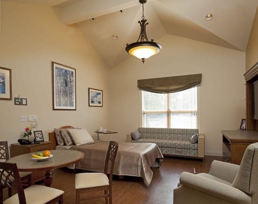 Private resident room with cozy furnishings and natural light