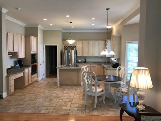 Bright, modern kitchen area with dining table