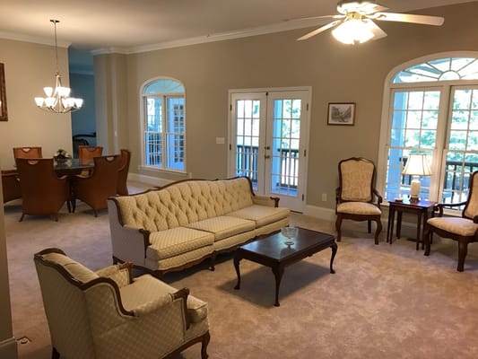Bright interior common area with seating and dining space