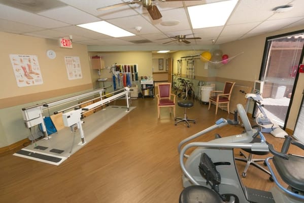 Well-equipped therapy room with exercise equipment