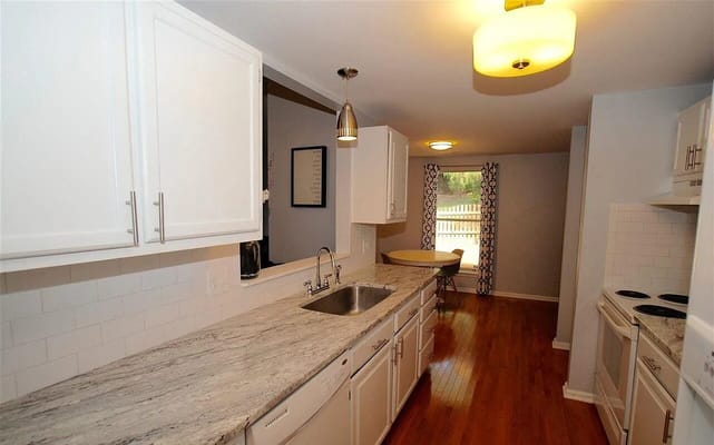 Bright and modern kitchen interior with cabinets and countertops