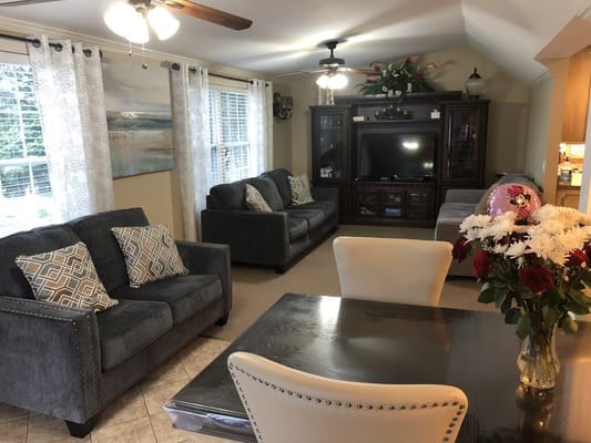Living room with comfortable seating and a dining area
