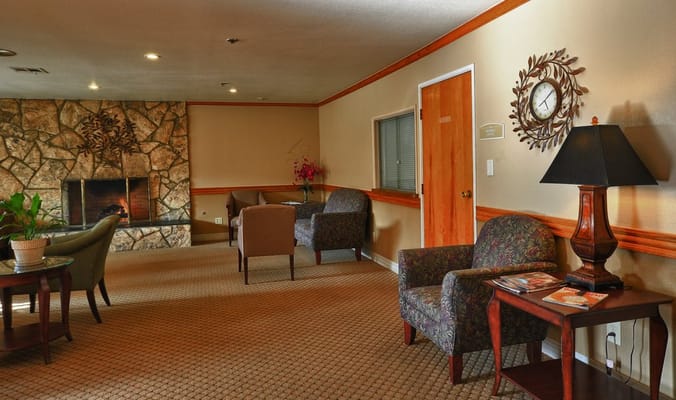 Cozy common area with seating and fireplace