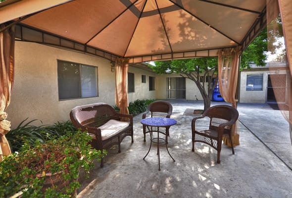 Outdoor seating area with a gazebo and chairs