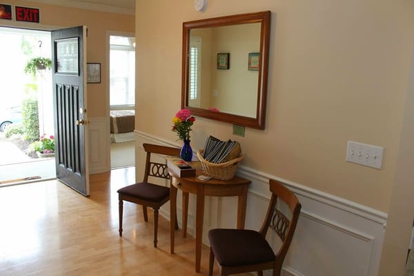Interior view of a welcoming entrance with seating