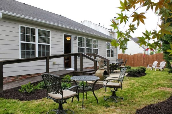 Outdoor patio area with seating and garden