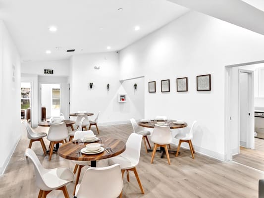 Bright dining room with modern tables and chairs