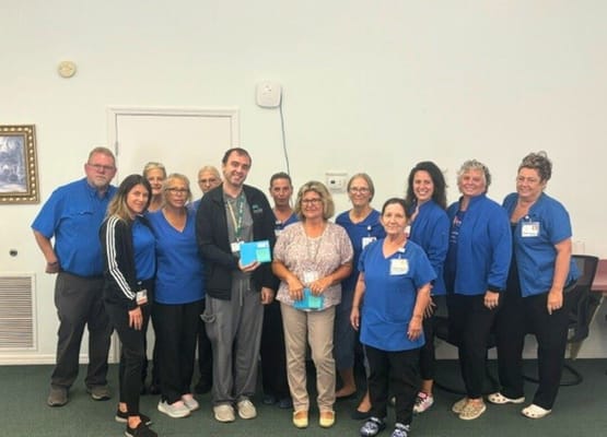 Staff posing together in a common area