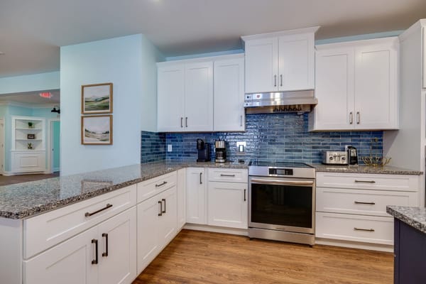 Modern kitchen with granite countertops and stainless steel appliances