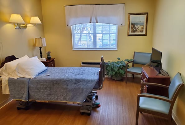 Private resident room with bed and seating