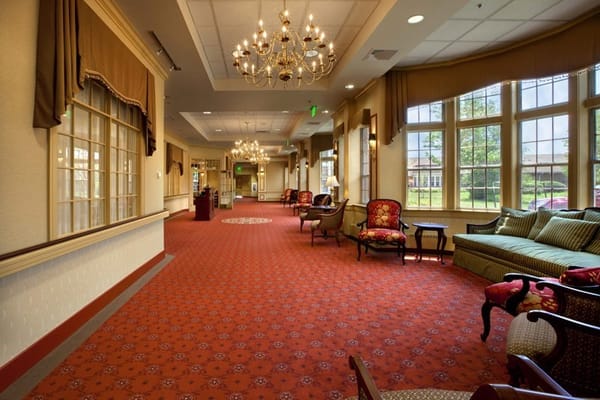 Spacious lounge with chandeliers and comfortable seating
