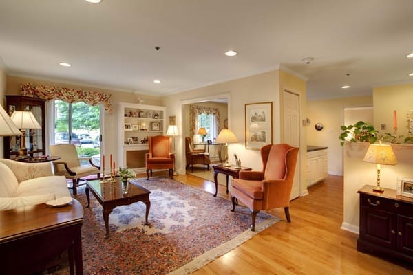 Bright and inviting living room with comfortable seating and decorative elements.