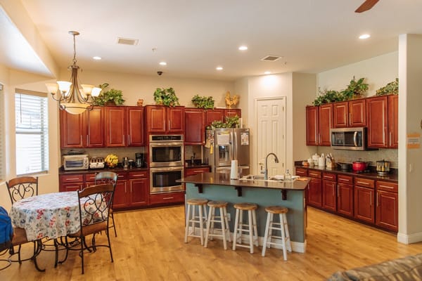 Bright and inviting kitchen with wooden cabinets and a dining table