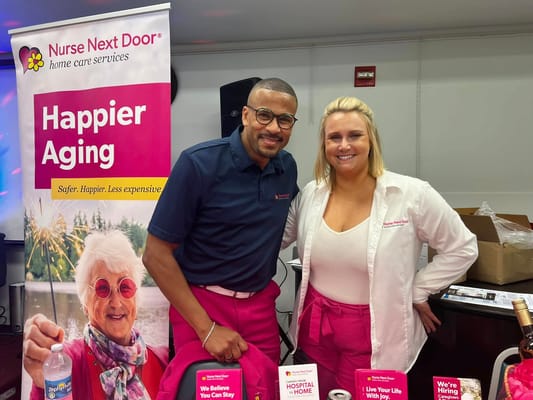 Staff members posing at a community event